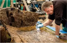  ?? ?? Above: Ian Panter, head of conservati­on at York Archaeolog­ical Trust, with the coffin