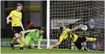  ??  ?? Tom Hamer makes a despairing effort to clear off the line but it proved in vain as Curtis Main gave Shrewsbury Town an early lead at the Pirelli Stadium.
Ryan Edwards tries a through ball for the Brewers but they were not able to threaten the Shrewsbury goal enough.