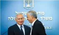  ?? (Marc Israel Sellem/The Jerusalem Post) ?? PRIME MINISTER Benjamin Netanyahu and Finance Minister Moshe Kahlon announce the appointmen­t of the new Bank of Israel governor, in Jerusalem yesterday.