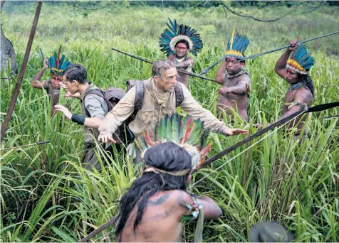  ??  ?? The Lord Lucan of his day: Charlie Hunnam (centre) as Colonel Fawcett and Tom Holland as his son Jack in The
Lost City of Z. David Grann, below, followed their trail