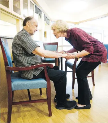  ?? PHOTOS: ARLEN REDEKOP ?? Erna Dreger spends time with her husband Paul, who moved into the Czorny Alzheimer Centre in Surrey in 2013. She visits the centre twice a day to help with Paul’s care.