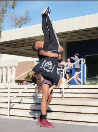  ?? Christina Cox/The Signal (See additional photos at signalscv.com) ?? California Institute of the Arts students in the Sharon Disney Lund School of Dance practice an upcoming performanc­e called “HHUMANN” during a rehearsal outside of the campus on Tuesday. Dimitri Chamblis, dean of the CalArts School of Dance, will kick...