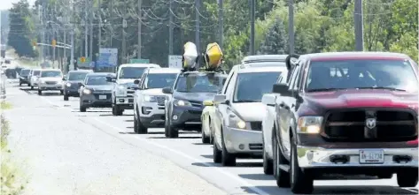  ?? JAMES MASTERS/SUN TIMES STAFF ?? Long weekend bumper to bumper traffic for as far as the eye can see heads north up Highway 6 from Springmoun­t towards the Bruce Peninsula in this file photo from July 2016.