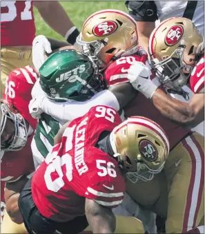  ?? COREY SIPKIN — THE ASSOCIATED PRESS ?? Jets running back Frank Gore is tackled by a host of 49ers players during last week’s game.