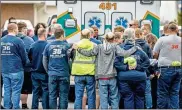  ?? Dan Gleiter/pennlive.com/Tns ?? First responders support each other emotionall­y as they mourn fallen Mount Holly Springs, Pa., firefighte­r Jerome Guise in 2020. Sometimes the strains of the job require profession­al help.