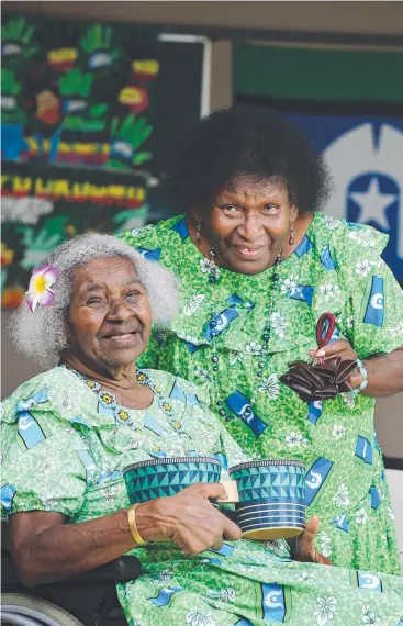  ?? Picture: BRENDAN RADKE ?? ENDURING CULTURE: Torres Strait Islander sisters Alma Enosa and Elizabeth Jackonia, who have both lived in Cairns for more than 20 years, get into the Naidoc spirit.