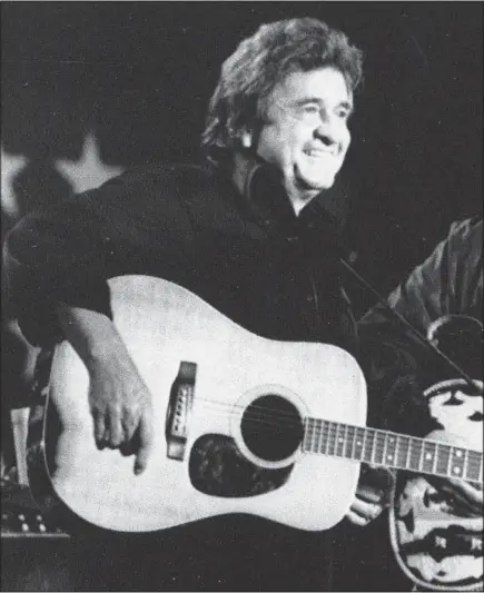  ?? MARY ALLEN/ASSOCIATED PRESS FILES ?? Country legend Johnny Cash, shown here at a 1985 benefit concert in Champaign, Ill., wasn’t afraid of being honest about his flaws.