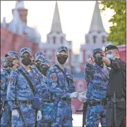  ?? (AP/Alexander Zemlianich­enko) ?? Russian National Guard soldiers stand for a briefing Sunday as they prepare to guard an area on Red Square in Moscow before the rehearsal for a military parade.