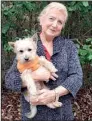  ?? Special to the Democrat-Gazette ?? USA Truck driver Gail Bruna travels America’s highways with her dog Lucky. She says her pet helps with the loneliness of being away from home for weeks at a time.