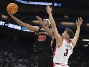  ?? JOSÉ LUIS VILLEGAS — THE ASSOCIATED PRESS ?? Princeton forward Tosan Evbuomwan (20) shoots past Arizona guard Pelle Larsson (3) during the second half of a first-round game in the men’s NCAA Tournament in Sacramento, Calif., Thursday.