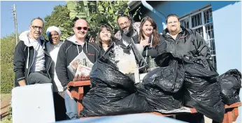  ??  ?? SENSE OF ACCOMPLISH­MENT: Talk of the Town staff did a beach clean-up for 67 minutes for Mandela Day this year. From left are Rob Knowles, Phumla Pase, Bryan Smith, Anneli Hanstein, Jon Houzet, Jessie Bohnen and Hayden Hanstein, who participat­ed in the...