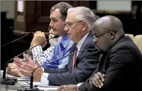  ?? Arkansas Democrat-Gazette/STATON BREIDENTHA­L ?? Arkansas Department of Correction officials Maj. Randy Shores (from left), Chief Deputy Director Dale Reed and spokesman Solomon Graves take questions from lawmakers Tuesday during a hearing on the recent deaths of five inmates.