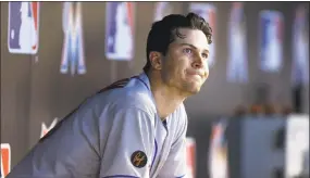  ?? Michael Reaves / Getty Images ?? Mets starter Jacob deGrom reacts in the dugout during New York’s 5-2 loss to the Marlins in Miami on Saturday.