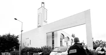  ?? — Reuters photo ?? Police secure a mosque in Creteil near Paris, France after a man was arrested after trying to drive a car into a crowd in front of the mosque.