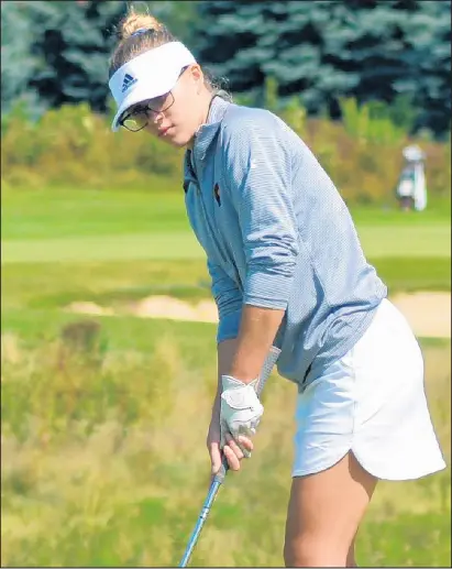  ?? PROVIDED BY PEYTON MARTINSON/POST-TRIBUNE ?? Chesterton’s Peyton Martinson watches a putt during a match at the Brassie Golf Club. Martinson, a senior, missed most of the 2019 season because of health issues.