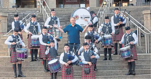  ??  ?? CELEBRATIO­N: The Scottish Fire and Rescue Novice Juvenile Pipe Band on the steps of the Buchanan Galleries at the launch of the Piping Live! festival