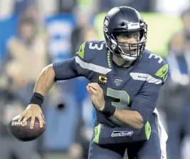  ?? Stephen Brashear, The Associated Press ?? Seahawks quarterbac­k Russell Wilson has been dropping cryptic hints about his future in Seattle.