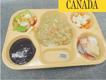  ??  ?? This photo of a food tray showing a typical federal prison meal was taken at Kent Institutio­n in Agassiz, B.C. The changeover to a “cook-chill system” has triggered many complaints about food quality from prisoners.