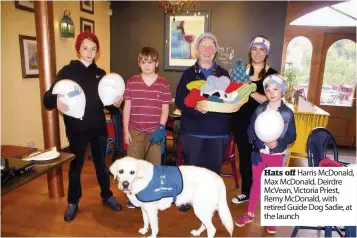  ??  ?? Hats off Harris McDonald, Max McDonald, Deirdre McVean, Victoria Priest, Remy McDonald, with retired Guide Dog Sadie, at the launch