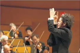  ??  ?? GUSTAVO DUDAMEL conducts the L.A. Philharmon­ic in the Bartók piece.