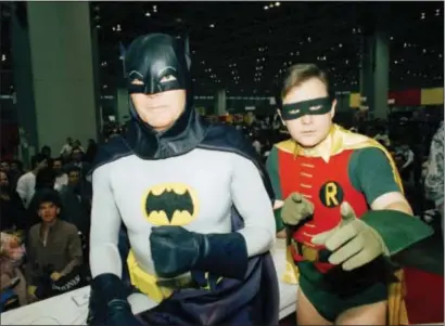  ?? MARK ELIAS — THE ASSOCIATED PRESS FILE ?? Above, actors Adam West, left, and Burt Ward, dressed as their characters Batman and Robin, pose for a photo at the “World of Wheels” custom car show in Chicago. On Saturday West’s family said the actor, who portrayed Batman in a 1960s TV series, has...