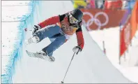  ?? AP PHOTO/KIN CHEUNG ?? Elizabeth Marian Swaney, of Hungary, runs the course during the women’s halfpipe qualifying at Phoenix Snow Park at the 2018 Winter Olympics in Pyeongchan­g, South Korea, Monday.