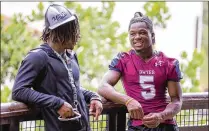  ?? ALLEN EYESTONE / THE PALM BEACH POST ?? James Meeks (left) and Antavious Lane hang out at a media event in West Palm Beach on Tuesday. Meeks plans to play for Palm Beach Central and Lane for Dwyer after Oxbridge Academy shut down its football program after last season.