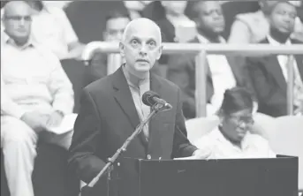  ??  ?? Minister of Communitie­s Ronald Bulkan addressing the gathering