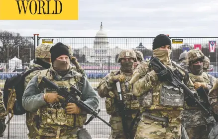  ?? STEPHANIE KEITH / GETTY IMAGES ?? National Guard patrol Washington's National Mall Tuesday, as fears of pro-trump violence prompted tight security before Joe Biden's inaugurati­on.