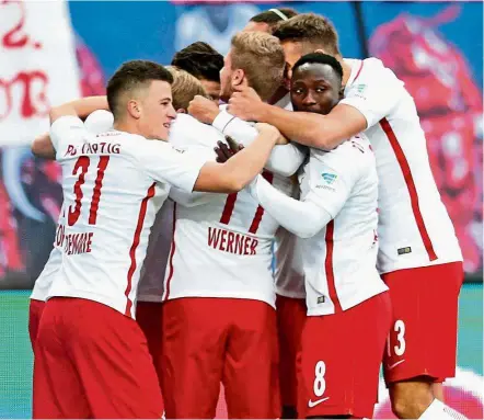  ??  ?? All together: Leipzig players celebrate after Timo Werner scored a goal against Mainz at the Red Bull Arena on Nov 6. Leipzing won 3-1. — EPA