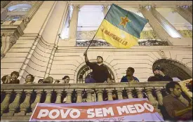  ?? AP ?? A banner reads in Portuguese: ‘People without fear, in the street against the coup’ during a protest against the government of acting President Michel Temer in Rio de Janeiro, Brazil on Friday.