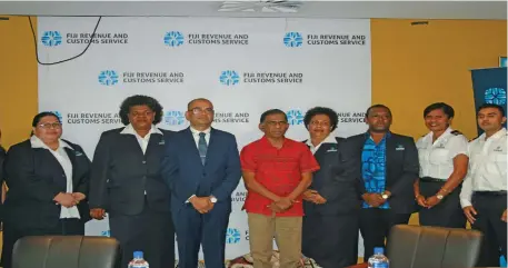  ?? . Photo: Kelera Sovasiga ?? Fiji Revenue and Customs Service chief executive officer Visvanath Das (fourth from left) and chairman Ajith Kodagoda with staff during the launch of the rebranding logo and new uniform on September 5, 2019