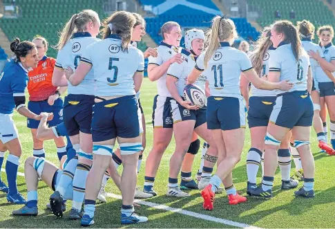  ??  ?? RARE BRIGHT SPOT: Scotland celebrate scoring a try in their 41-20 loss to Italy at Scotstoun Stadium.