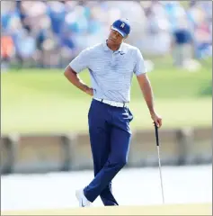  ??  ?? Woods reacts after a quadruple bogey on the 17th hole during the second round of The PLAYeRp Championsh­ip on The ptadium Course at TPC pawgrass in Ponte sedra Beach, Florida. — AFP photo
