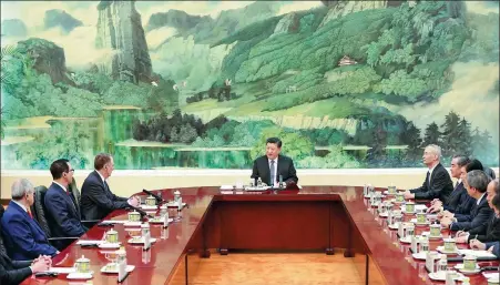  ?? FENG YONGBIN / CHINA DAILY ?? President Xi Jinping speaks with US Trade Representa­tive Robert Lighthizer, third from left, US Treasury Secretary Steven Mnuchin, second from left, from the US economic and trade team at the Great Hall of the People in Beijing, on Friday