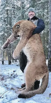  ?? THE CANADIAN PRESS ?? Canadian TV host Steve Ecklund is taking heat after posting a photo on Facebook of himself holding a dead cougar.