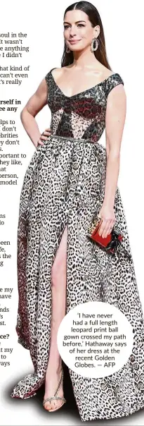  ?? — AFP ?? ‘I have never had a full length leopard print ball gown crossed my path before,’ Hathaway says of her dress at the recent Golden Globes.