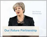  ?? AP/LEON NEAL ?? British Prime Minister Theresa May speaks Friday in London about trade with the European Union after Britain leaves the bloc. “In certain ways, our access to each other’s markets will be less than it is now,” she said.