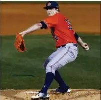  ?? BUTCH DILL — THE ASSOCIATED PRESS FILE ?? File-This file photo shows Auburn pitcher Casey Mize throwing during the first inning of a Southeaste­rn Conference tournament NCAA college baseball game against Texas A&amp;M in Hoover, Ala. Mize has dazzled scouts for months with his impressive arsenal of pitches. The tantalizin­gly talented Auburn righthande­r could find himself leading off the Major League Baseball draft on Monday night, with the Detroit Tigers ready to go on the clock with the No. 1 pick.