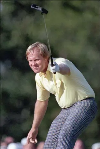  ?? THE ASSOCIATED PRESS ?? FILE - In this Sunday, April 13, 1986, file photo, Jack Nicklaus watches his shot go for a birdie on the 17th at the Masters golf tournament in Augusta, Ga. Curtis Strange says every player who finished stayed in the locker room to watch the...