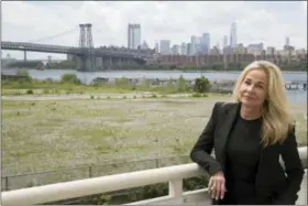  ?? MARY ALTAFFER — THE ASSOCIATED PRESS ?? In this photo, Sabine Anton poses for a photo on the balcony of her apartment in the building overlookin­g lower Manhattan and the Williamsbu­rg bridge at 184 Kent Avenue in the Brooklyn borough of New York. An Associated Press investigat­ion into one of...