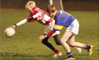  ??  ?? Stephen Murphy of Gorey stretches to keep the ball away from Rowan O’Keeffe (Taghmon).