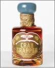  ?? QUAKER CITY MERCANTILE PHOTO VIA AP ?? Crab Trapper is a whiskey made with green crabs, from House of Tamworth.