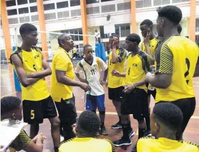  ?? KAVARLY ARNOLD PHOTO BY ?? Jamaica Under-19 men’s volleyball coach Steve Davis gives his team instructio­ns during the Caribbean Zonal Volleyball Associatio­n Youth Tournament at the G.C. Foster College in St Catherine on Monday, July 22.