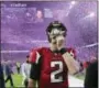  ?? CURTIS COMPTON — ATLANTA JOURNAL-CONSTITUTI­ON VIA AP, FILE ?? Falcons quarterbac­k Matt Ryan reacts after losing Super Bowl 51 as the screen flashes New England Patriots quarterbac­k Tom Brady and confetti flies in Houston.