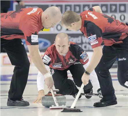  ?? ANDREW VAUGHAN/ THE CANADIAN PRESS ?? Team Canada skip Pat Simmons releases a rock as Nolan Thiessen, left, and Carter Rycroft sweep during Thursday action at the world men’s curling championsh­ip in Halifax. Team Canada plays Norway in a No. 1 vs. No. 2 Page playoff game on Friday night.