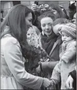  ?? ARTHUR EDWARDS/THE ASSOCIATED PRESS ?? Britain’s Kate Duchess of Cambridge, left, meets with the public Nov. 28 as she arrives at the Guildhall during a visit to Cambridge.