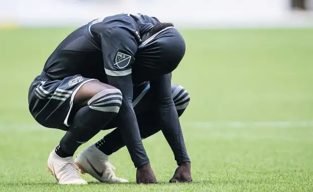 ?? — THE CANADIAN PRESS FILES ?? There have been too many scenes like this for the Vancouver Whitecaps this season as Alphonso Davies and his teammates were eliminated from MLS playoff contention Sunday after a 2-2 draw with LAFC. They have one game left next weekend when Portland visits.