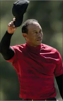  ?? JAE C. HONG — THE ASSOCIATED PRESS ?? Tiger Woods tips his cap on the 18th green during the final round of the Masters Sunday. Woods finished 47th (13over par) in his first PGA Tour competitio­n since suffering major injuries and nearly losing a leg in a February 2021car accident.