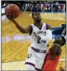  ?? AP/NATI HARNIK ?? Kansas’ Malik Newman led the Jayhawks with 17 points in an 80-76 victory over the Clemson Tigers in the Midwest Regional in Omaha, Neb. The Jayhawks advanced to the regional final for the third consecutiv­e year.